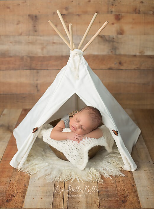 Baby boy in teepee